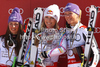 Overall FIS alpine skiing World cup winner Lindsey Vonn of USA (M), second placed Tina Maze of Slovenia (L) and third placed Maria Hoefl-Riesch of Germany (R) celebrate their medals after last race of Audi FIS Alpine skiing World cup finals in Schladming, Austria. Last women race of Audi FIS Alpine skiing World cup finals was held in Schladming, Austria, on Sunday, 18th of March 2012.
