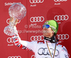 Overall FIS alpine skiing World cup winner Marcel Hirscher of Austria celebrates his trophy after last race of Audi FIS Alpine skiing World cup finals in Schladming, Austria. Last men race of Audi FIS Alpine skiing World cup finals was held in Schladming, Austria, on Sunday, 18th of March 2012.
