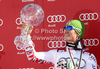 Overall FIS alpine skiing World cup winner Marcel Hirscher of Austria celebrates his trophy after last race of Audi FIS Alpine skiing World cup finals in Schladming, Austria. Last men race of Audi FIS Alpine skiing World cup finals was held in Schladming, Austria, on Sunday, 18th of March 2012.
