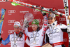 Overall FIS alpine skiing World cup winner Marcel Hirscher of Austria (M), second placed Beat Feuz of Switzerland (L) and third placed Aksel Lund Svindal of Norway (R) celebrate their medals after last race of Audi FIS Alpine skiing World cup finals in Schladming, Austria. Last men race of Audi FIS Alpine skiing World cup finals was held in Schladming, Austria, on Sunday, 18th of March 2012.

