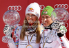 Overall Men FIS alpine skiing World cup winner Marcel Hirscher of Austria (R) and overall Women FIS alpine skiing World cup winner Lindsey Vonn of USA celebrate their trophies after last race of Audi FIS Alpine skiing World cup finals in Schladming, Austria. Last race of Audi FIS Alpine skiing World cup finals was held in Schladming, Austria, on Sunday, 18th of March 2012.
