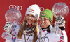 Overall Men FIS alpine skiing World cup winner Marcel Hirscher of Austria (R) and overall Women FIS alpine skiing World cup winner Lindsey Vonn of USA celebrate their trophies after last race of Audi FIS Alpine skiing World cup finals in Schladming, Austria. Last race of Audi FIS Alpine skiing World cup finals was held in Schladming, Austria, on Sunday, 18th of March 2012.
