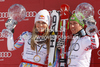 Overall Men FIS alpine skiing World cup winner Marcel Hirscher of Austria (R) and overall Women FIS alpine skiing World cup winner Lindsey Vonn of USA celebrate their trophies after last race of Audi FIS Alpine skiing World cup finals in Schladming, Austria. Last race of Audi FIS Alpine skiing World cup finals was held in Schladming, Austria, on Sunday, 18th of March 2012.
