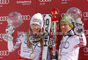 Overall Men FIS alpine skiing World cup winner Marcel Hirscher of Austria (R) and overall Women FIS alpine skiing World cup winner Lindsey Vonn of USA celebrate their trophies after last race of Audi FIS Alpine skiing World cup finals in Schladming, Austria. Last race of Audi FIS Alpine skiing World cup finals was held in Schladming, Austria, on Sunday, 18th of March 2012.

