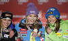 Winner and new super-g World champion Tina Maze of Slovenia (M), second placed Lara Gut of Switzerland (L) and third placed Julia Mancuso of USA (R) celebrate their medals won in women Super-g race of FIS Alpine skiing World Championships in Schladming, Austria. Women super-g race of FIS Alpine skiing World championships Schladming 2013, was held in Scladming, Austria, on Tuesday, 5th of February 2013.
