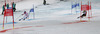 Maria Hoefl-Riesch of Germany (L) and Erin Mielzynski of Canada (R) skiing in Nations team event of FIS Alpine skiing World Championships in Schladming, Austria. Nations team event of FIS Alpine skiing World championships Schladming 2013, was held in Schladming, Austria, on Tuesday, 12th of February 2013.
