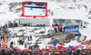 Third placed Marcel Hirscher of Austria skiing while Austrian fans celebrate in finish of the second run of men Audi FIS Alpine skiing World cup giant slalom race. Men giant slalom race of Audi FIS Alpine skiing World cup 2013-2014 was held on Sunday, 27th of October 2013 on Rettenbach glacier above Soelden, Austria.
