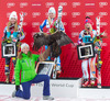 2nd place Mikaela Shiffrin of the USA, 1st place Jessica Lindell-Vikarby of Sweden, 3rd place Tina Weirather of Lichtenstein Celebrate on Podium with an Eagle of the Raptor Foundation after ladies Giant Slalom of the Beaver Creek FIS Ski Alpine World Cup at the Birds of Prey Raptor in Beaver Creek, United States on 2012/12/01.
