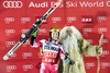 2nd placed Ted Ligety of the USA celebrates on podium with Santa Claus during winner presentation after men Giant Slalom of FIS Ski World Cup at Olympia Course in Are, Sweden on 2014/12/12.
