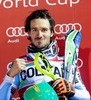 Winner Felix Neureuther of Germany celebrates on Podium after men Madonna di Campiglio Slalom of the FIS Ski Alpine World Cup at the Canalone Miramonti in Madonna di Campiglio, Italy on 2014/12/22.
