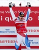 First placed Patrick Kueng of Switzerland celebrates on podium during the winner presentation after the mens Downhill of FIS Ski World Championships 2015 at the Birds of Prey Course in Beaver Creek, United States on 2015/02/07.
