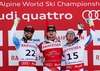 Winner Patrick Kueng of Switzerland (M), second placed Travis Ganong of USA (L) and third placed Beat Feuz of Switzerland (R) celebrates on podium during the winner presentation after the mens Downhill of FIS Ski World Championships 2015 at the Birds of Prey Course in Beaver Creek, United States on 2015/02/07.
