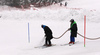 FIS assistant referee Emanuel Couder (L) and Kranjska Gora course workers preparing track before start of the first run of the men slalom race of Audi FIS Alpine skiing World cup in Kranjska Gora, Slovenia, after heavy snow during last night. Men slalom race of Audi FIS Alpine skiing World cup, was held in Kranjska Gora, Slovenia, on Sunday, 6th of March 2016.
