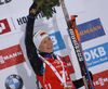 Winner Darya Domracheva of Belarus celebrate her medal won in the women 7.5km sprint race of IBU Biathlon World Cup in Hochfilzen, Austria.  Women 7.5km sprint race of IBU Biathlon World cup was held in Hochfilzen, Austria, on Friday, 8th of December 2017.
