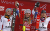 Winner Mikaela Shiffrin of USA (M), second placed Bernadette Schild of Austria (L) and third placed Frida Hansdotter of Sweden (R) celebrate their medals won in the women night slalom race of the Audi FIS Alpine skiing World cup in Flachau, Austria. Women slalom race of the Audi FIS Alpine skiing World cup was held in Flachau, Austria, on Tuesday, 9th of January 2018.
