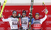 Winner Beat Feuz of Switzerland (R) and second placed Vincent Kriechmayr of Austria (L) and Dominik Paris of Italy (R) celebrate on the podium after men downhill race of the Audi FIS Alpine skiing World cup in Garmisch-Partenkirchen, Germany. Men downhill race of the Audi FIS Alpine skiing World cup was held on Kandahar track in Garmisch-Partenkirchen, Germany, on Saturday, 27th of January 2018.
