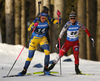 Elvira Oeberg of Sweden and Anna Gandler of Austria (R) competing during Women Sprint race of BMW IBU Biathlon World cup in Pokljuka, Slovenia. Women Sprint race of BMW IBU Biathlon World cup was held in Pokljuka, Slovenia, on Thursday 5th of January 2023.