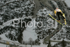 Hyun-Ki Kim of Korea on inrun during first training jump of FIS Ski jumping World Cup finals in Planica, Slovenia. Training and qualification sessions for FIS Ski jumping World cup were held in Planica, Slovenia, on K215 ski flying hill on 13th of March, 2008.  <br> FIS Ski jumping World cup finals were held in Planica, Slovenia between 13th and 16th of March 2008.
