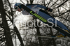 Juha-Matti Ruuskanen of Finland soars through the air during qualification jump of FIS Ski jumping World Cup finals in Planica, Slovenia. Training and qualification sessions for FIS Ski jumping World cup were held in Planica, Slovenia, on K215 ski flying hill on 13th of March, 2008.  <br> FIS Ski jumping World cup finals were held in Planica, Slovenia between 13th and 16th of March 2008.
