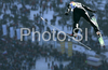 Jurij Tepes of Slovenia soars through the air during training jump of FIS Ski jumping World Cup finals in Planica, Slovenia. Training session for team event of FIS Ski jumping World cup was held in Planica, Slovenia, on K215 ski flying hill on 15th of March, 2008.  <br> FIS Ski jumping World cup finals were held in Planica, Slovenia between 13th and 16th of March 2008.

