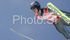 Thomas Morgenstern of Austria soars through the air during first series of team event of FIS Ski jumping World Cup finals in Planica, Slovenia. Team event of FIS Ski jumping World cup finals was held in Planica, Slovenia, on K215 ski flying hill on 15th of March, 2008.  <br> FIS Ski jumping World cup finals were held in Planica, Slovenia between 13th and 16th of March 2008.
