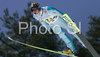 Jussi Hautamaeki of Finland soars through the air during first series of team event of FIS Ski jumping World Cup finals in Planica, Slovenia. Team event of FIS Ski jumping World cup finals was held in Planica, Slovenia, on K215 ski flying hill on 15th of March, 2008.  <br> FIS Ski jumping World cup finals were held in Planica, Slovenia between 13th and 16th of March 2008.

