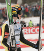 Third placed Janne Happonen of Finland reacts after second jump of last race of FIS Ski jumping World Cup finals in Planica, Slovenia. Last race of FIS Ski jumping World cup was held in Planica, Slovenia, on K215 ski flying hill on 16th of March, 2008.  <br> FIS Ski jumping World cup finals were held in Planica, Slovenia between 13th and 16th of March 2008.
