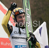 Third placed Janne Happonen of Finland celebrate his medal won in last race of FIS Ski jumping World Cup finals in Planica, Slovenia. Last race of FIS Ski jumping World cup were held in Planica, Slovenia, on K215 ski flying hill on 16th of March, 2008.  <br> FIS Ski jumping World cup finals were held in Planica, Slovenia between 13th and 16th of March 2008.
