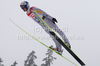 Adam Malysz of Poland soars through the air during ski jumping race on HS106 hill on FIS Nordic skiing World championships in Oslo, Norway. Ski jumping race on HS106 hill of FIS Nordic skiing World championships was held on Holmenkollen above Oslo, Norway, on Saturday, 26th of February 2011.
