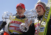 Winner Thomas Morgenstern of Austria (M) with his coach Alexander Pointner (L) celebrates World cup overall medal won in FIS ski jumping World Cup 2010-2011. Final race of  FIS ski jumping World cup 2010-2011 was held on Sunday, 20th of March 2011, in Planica, Slovenia.
