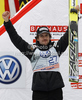 Second placed Simon Ammann of Switzerland celebrates his medal won in the Flying hill Individual competition of FIS World cup ski jumping  finals in Planica, Slovenia. Flying hill Individual  competition FIS World ski jumping finals was held on Sunday, 18th of March 2012, in Planica, Slovenia.1
