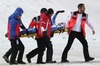 Andreas Kofler (AUT) is being taken away after his crash during Mens FIS Ski Jumping world cup at the Vogtland Arena in Klingenthal, Germany on 2013/11/24.
