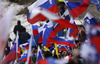 Slovenian fans wave their flags  during the women race of Viessmann FIS ski jumping World cup in Planica, Slovenia. Women race of Viessmann FIS ski jumping World cup 2013-2014 was held on Saturday, 22nd of March 2014 on HS139 ski jumping hill in Planica, Slovenia.
