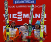 Overall World cup winner Sara Takanashi of Japan (M), second placed Carina Vogt of Germany (L) and third placed Yuki Ito of Japan (R) celebrate their success with crystal trophy and medals after women race of Viessmann FIS ski jumping World cup in Planica, Slovenia. Women race of Viessmann FIS ski jumping World cup 2013-2014 was held on Saturday, 22nd of March 2014 on HS139 ski jumping hill in Planica, Slovenia.
