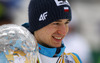 Kamil Stoch of Poland celebrates winning overall FIS Ski jumping World cup with his crystal globe after last race of Viessmann FIS ski jumping World cup season 2013-2014 in Planica, Slovenia. Last race of Viessmann FIS ski jumping World cup season 2013-2014 was held on Sunday, 23rd of March 2014 on HS139 ski jumping hill in Planica, Slovenia.
