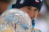 Kamil Stoch of Poland celebrates winning overall FIS Ski jumping World cup with his crystal globe after last race of Viessmann FIS ski jumping World cup season 2013-2014 in Planica, Slovenia. Last race of Viessmann FIS ski jumping World cup season 2013-2014 was held on Sunday, 23rd of March 2014 on HS139 ski jumping hill in Planica, Slovenia.
