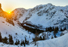 Sun is rising over mountains above Ljubelj road pass near Trzic, Slovenia, on early morning of 17th of December 2020. Sunrise is seen from slopes of Vrtaca mountain during ski mountaineering tour.