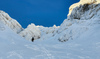 Ski mountaineering to Vrtaca mountain above Ljubelj road pass near Trzic, Slovenia, on early morning of 17th of December 2020. Sunrise is seen from slopes of Vrtaca mountain during ski mountaineering tour.