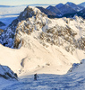 Ski mountaineering to Vrtaca mountain above Ljubelj road pass near Trzic, Slovenia, on early morning of 17th of December 2020. Sunrise is seen from slopes of Vrtaca mountain during ski mountaineering tour.