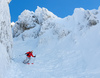 Ski down steep Y chute on NorthEast face of Vrtaca mountain above Ljubelj road pass near Trzic, Slovenia, on early morning of 17th of December 2020.