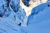 Ski down steep Y chute on NorthEast face of Vrtaca mountain above Ljubelj road pass near Trzic, Slovenia, on early morning of 17th of December 2020.