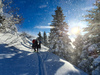 Ski touring in mountains above Jesenice, Slovenia, on windy but sunny 26th of December 2020. After 2 days of snowing mountains woke up in sunny day with 30cm of fresh snow, but also strong winds, which was drifting snow around.