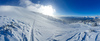 Ski touring in mountains above Jesenice, Slovenia, on windy but sunny 26th of December 2020. After 2 days of snowing mountains woke up in sunny day with 30cm of fresh snow, but also strong winds, which was drifting snow around.