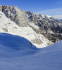 Winter in mountains above Vrata valley near Mojstrana, Slovenia. Even though temperatures in valley are spring like already, winter higher up in mountains is still present and offers plenty of joy for ski tourers and mountaineers.