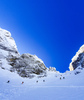 Winter in mountains above Vrata valley near Mojstrana, Slovenia. Even though temperatures in valley are spring like already, winter higher up in mountains is still present and offers plenty of joy for ski tourers and mountaineers.