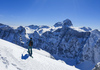 Winter in mountains above Vrata valley near Mojstrana, Slovenia. Even though temperatures in valley are spring like already, winter higher up in mountains is still present and offers plenty of joy for ski tourers and mountaineers.