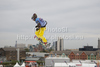 A snowboarder takes to the air competing in the training session of the FIS Snowboard Big Air World Cup and freestyle skiing show at the London Freeze Festival at Battersea Power Station, London.
