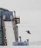 A snowboarder takes to the air competing in the training session of the FIS Snowboard Big Air World Cup and freestyle skiing show at the London Freeze Festival at Battersea Power Station, London.
