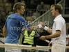 Jarkko Nieminen (L) of Finland and Gregor Zemlja of Slovenia (R) during match of Davis Cup between Slovenia and Finland. Match between Jarkko Nieminen of Finland and Gregor Zemlja of Slovenia was held in Tivoli Arena in Ljubljana, Slovenia, on Friday, 4th of March 2011.
