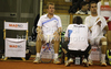 Luka Gregorc (R), Gregor Zemlja of Slovenia (L) and captain of team Slovenia, Blaz Trupej (M) during doubles match of Davis Cup between Slovenia and Finland. Match between Jarkko Nieminen and Harri Heliovaara of Finland, and Gregor Zemlja, and Luka Gregorc of Slovenia was held in Tivoli Arena in Ljubljana, Slovenia, on Saturday, 5th of March 2011.
